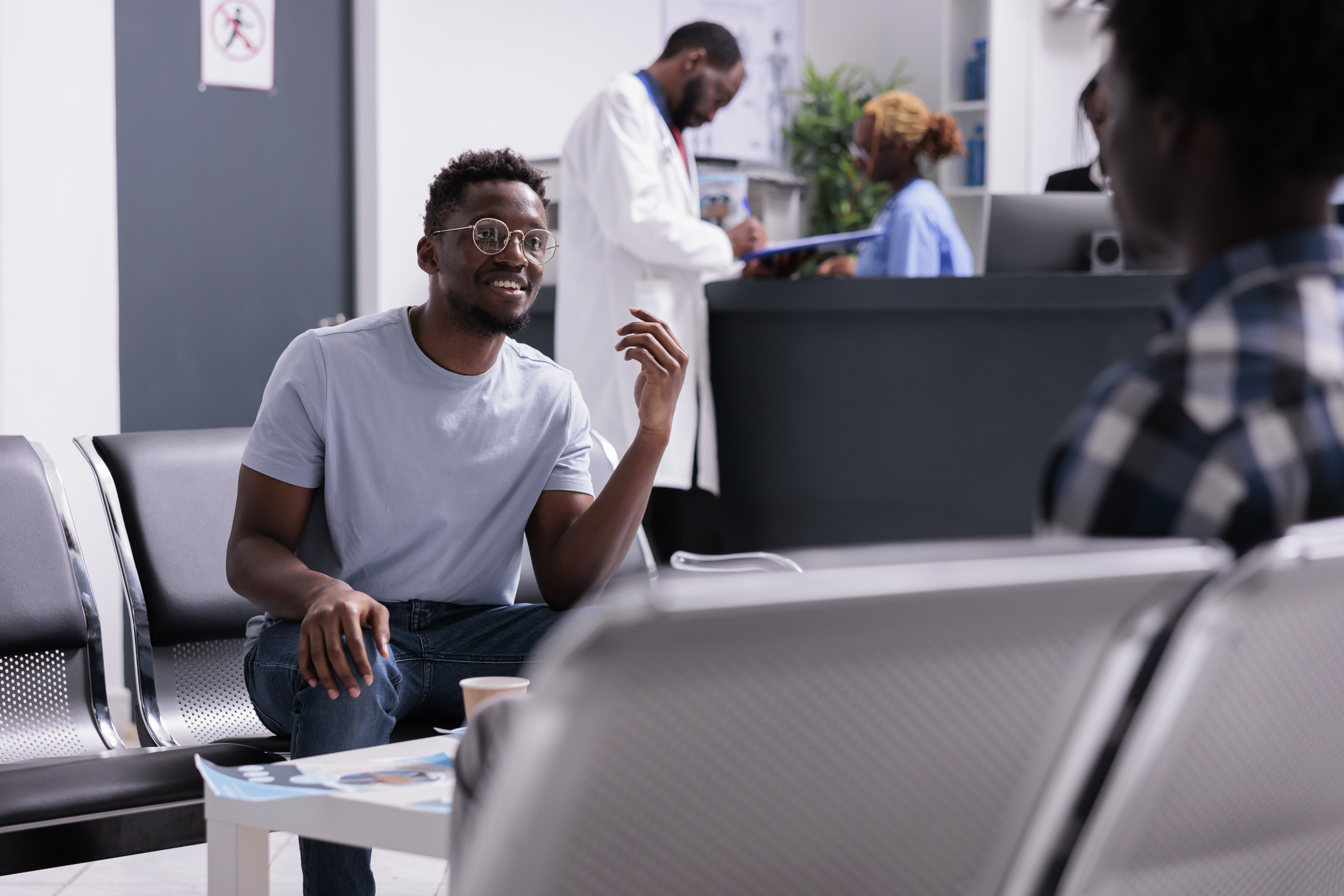 african-american-people-talking-about-medicine-diagnosis-waiting-room-lobby-health-center-group-men-sitting-area-hospital-reception-before-attending-checkup-examination.jpg